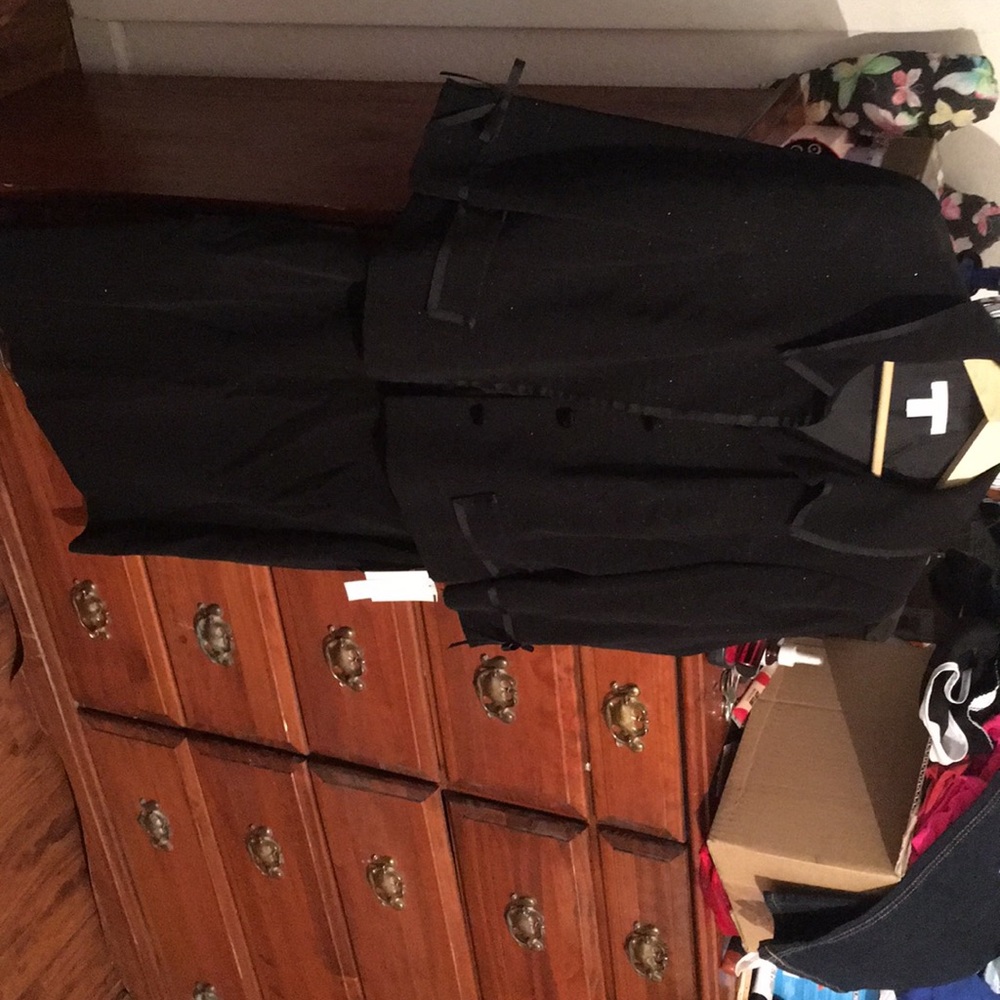 Black sparkling matching jacket and skirt.
